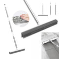 Carpet rake with squeegee edge shown from two angles, with close-ups of the soft bristle head, the three-piece handle and the squeegee wiping a tiled floor.
