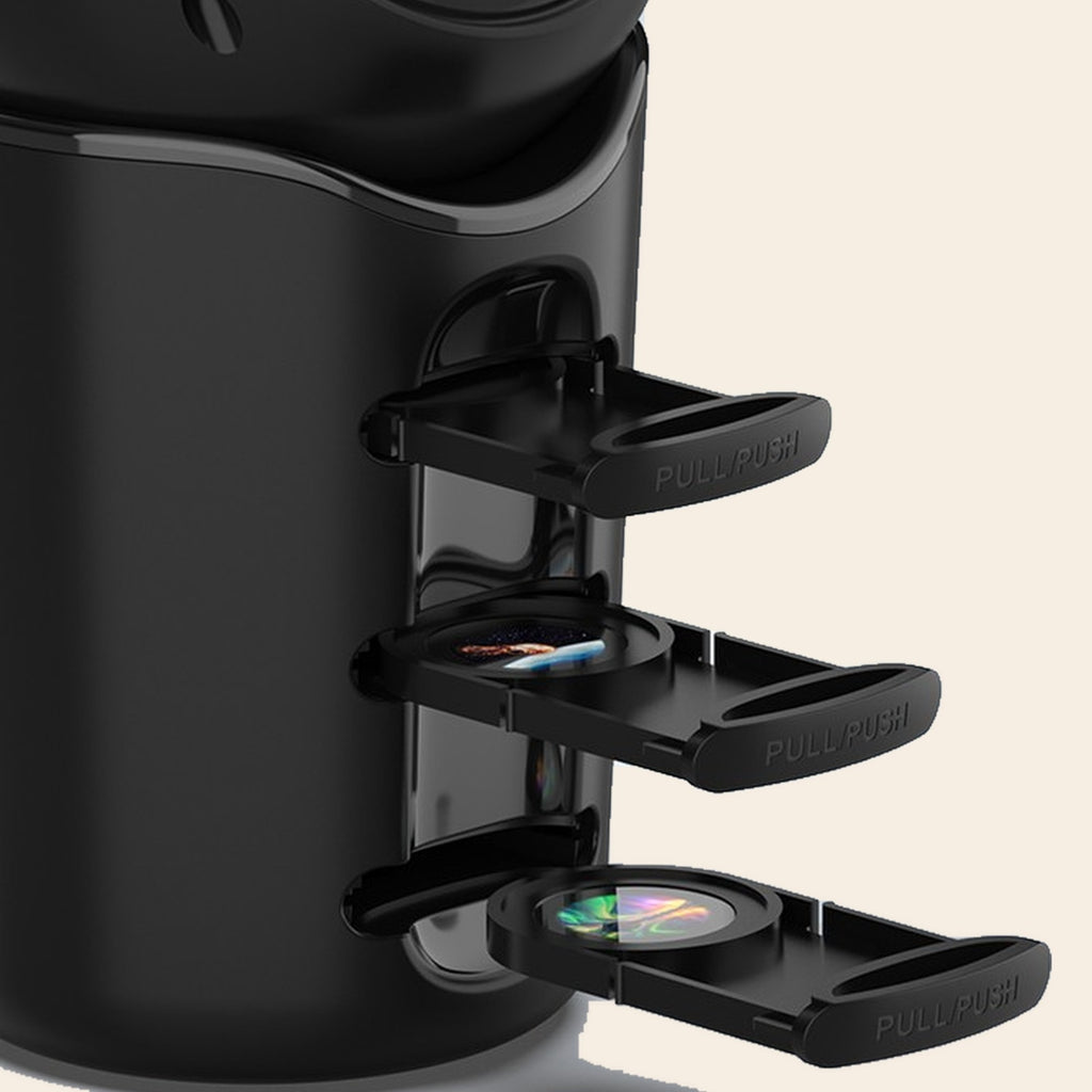 Close-up of the Galaxy Starry Sky Projector with its film-slide trays pulled out of the body