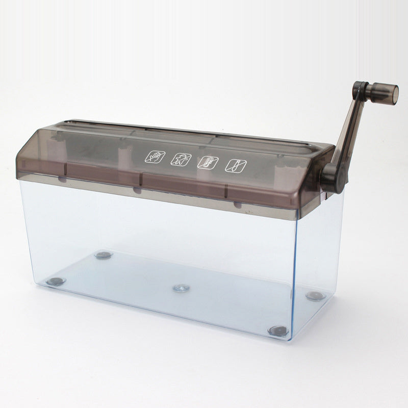 A hand-crank paper shredder on a plain white background, seen from the side with its clear bin empty and the crank handle on the right.