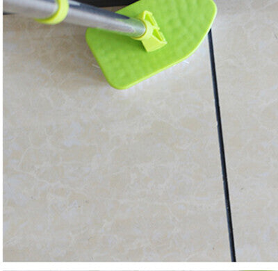 Sponge head being pushed along a grout line on a tiled floor